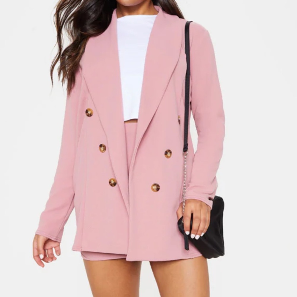 Pink button detail blazer.